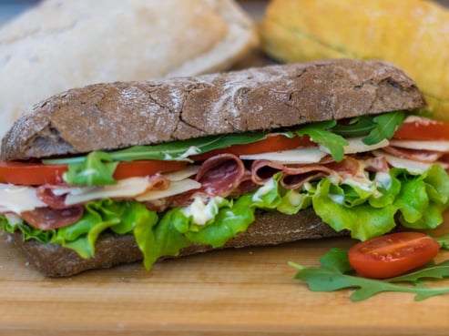 static-shot-of-a-light-turkey-bread-roll-and-a-dark-balkan-sandwich-picture-id1130507504